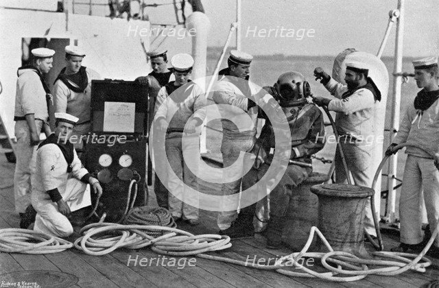 Diver and his apparatus on board HMS 'Blake', 1896. Artist: Gregory & Co