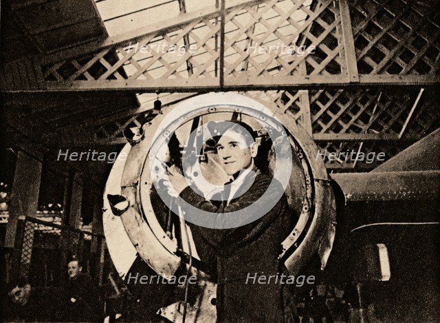 A metal worker with automatic drill stripping an engine casing, 1940. Artist: Unknown