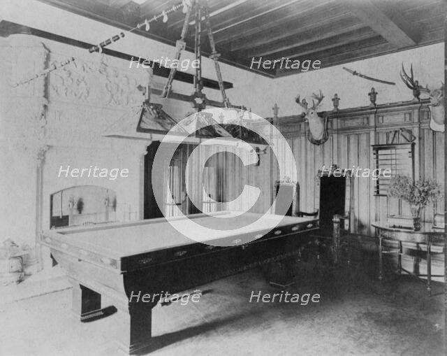 Billiard room, with a deer head and an elk head, in home of Edmund..., Greenwich, Connecticut, 1908. Creator: Frances Benjamin Johnston.