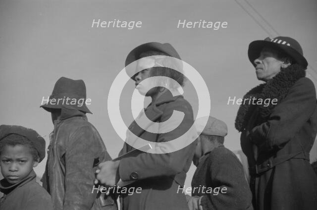 Possibly: Negroes in the lineup for food at mealtime in the camp..., Forrest City, Arkansas, 1937. Creator: Walker Evans.