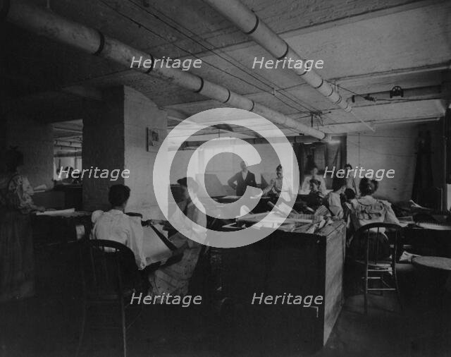 Workers taking mucilaged sheets of postage stamps from the drying box in the gumming..., c1895. Creator: Frances Benjamin Johnston.