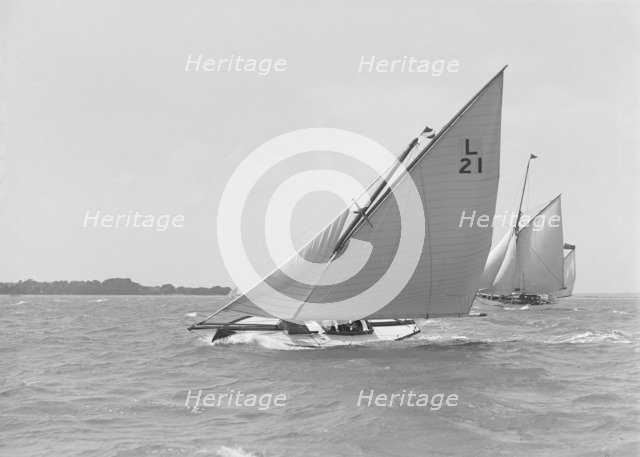 The 6 Metre 'Cheetal' (L21) sailing upwind, 1911. Creator: Kirk & Sons of Cowes.