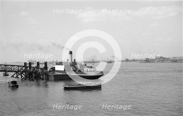 A car ferry unloads at Gravesend, Kent, c1945-c1965. Artist: SW Rawlings