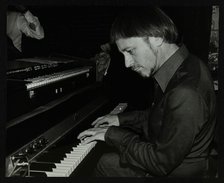 Michael Garrick playing the piano at The Bell, Codicote, Hertfordshire, 28 October 1980. Artist: Denis Williams
