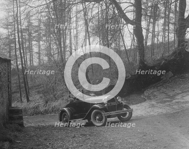 Kitty Brunell driving a 1930 2-seater Ford Model A, 1931.   Artist: Bill Brunell.