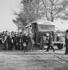 The children from Dead Ox Flat get off bus at school yard, Ontario, Oregon, 1939. Creator: Dorothea Lange.