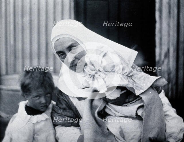 Gloucester smallpox epidemic, 1896: Elsie Clutterbuck (right), a smallpox patient, with..., 1896. Creator: HCF of Gloucester.