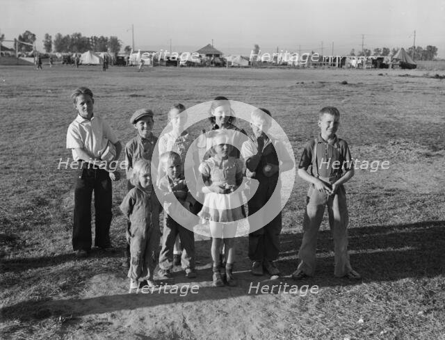 Children of migratory pea pickers in Brawley camp, California, 1939. Creator: Dorothea Lange.