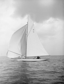 The 8 Metre 'Ventana' (H11) sailing with spinnaker, 1912. Creator: Kirk & Sons of Cowes.