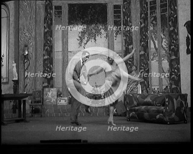 Scene from a Stage Show: Male and Female Civilians Dancing on a Stage in a Routine with..., 1929. Creator: British Pathe Ltd.