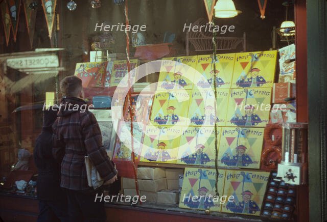 Boy looking at store window display of toys, between 1941 and 1942. Creator: Unknown.