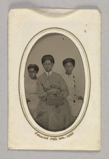 Tintype in a paper case of three unidentified young women seated, 1870s. Creator: Unknown.