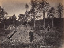 Woodchoppers' Huts in a Virginia Forest. On the Orange & Alexandria Railroad. Wood Su..., June 1863. Creator: Andrew Joseph Russell.