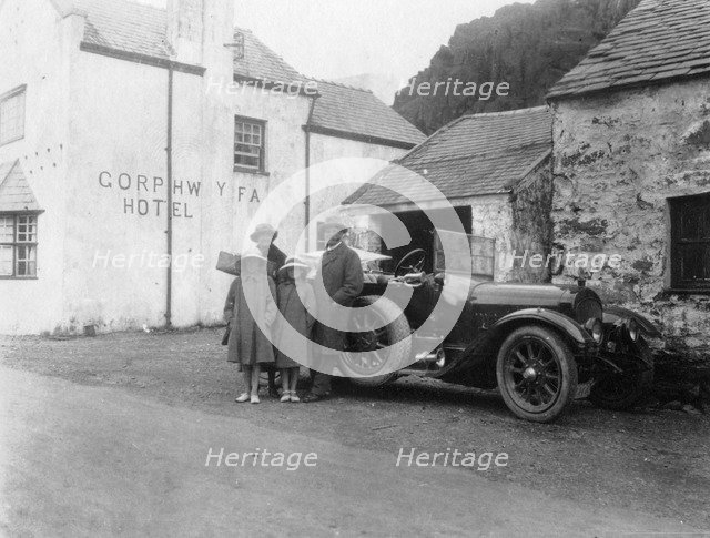 A family standing beside their car, Gorphwysfa Hotel, North Wales, c1920s-c1930s(?). Artist: Unknown