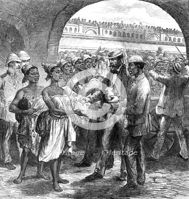 The Ashantee War: paying...Fantee women carriers at Cape Coast Castle...by our special artist, 1874. Creator: Unknown.