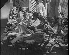 People Sitting on Deck Chairs on the Deck of a Cruise Liner Whilst at Sea, 1931. Creator: British Pathe Ltd.