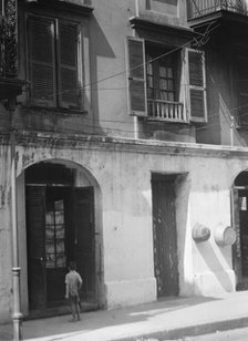 Pedesclaux-Lemonnier House, 640 Royal Street, New Orleans, between 1920 and 1926. Creator: Arnold Genthe.