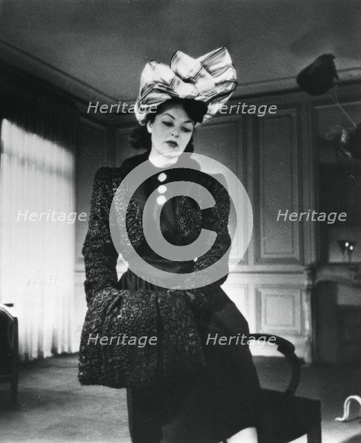 Nina Ricci outfit worn by the fashion model Gabrielle, France, January 1943. Artist: Unknown