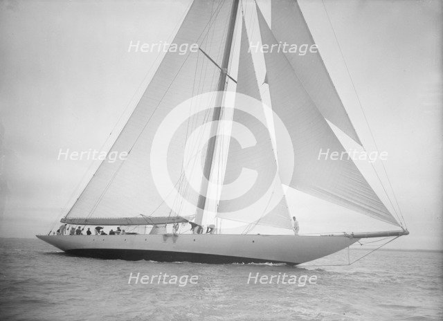 The 23-metre cutter 'Astra' sailing close-hauled, 1935. Creator: Kirk & Sons of Cowes.