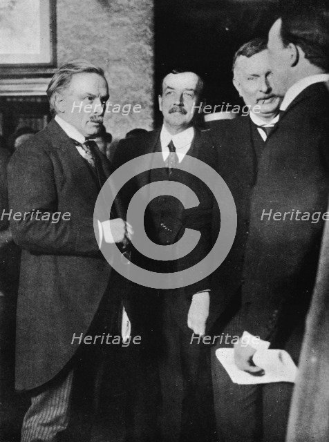 'Mr. Lloyd George, Mr. Runciman, and Mr. Henderson at the Park Hotel, Cardiff, after their interview Artist: Unknown.