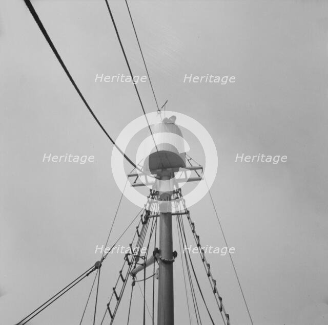 Possibly: Frank Mineo, owner of the Alden, climbs to the crow's..., Gloucester, Massachusetts], 1943 Creator: Gordon Parks.
