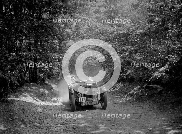 MG J2 taking part in the B&HMC Brighton-Beer Trial, Fingle Bridge Hill, Devon, 1934. Artist: Bill Brunell.