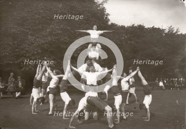 Boys pose in an outdoor gym lesson, 1929. Artist: Unknown