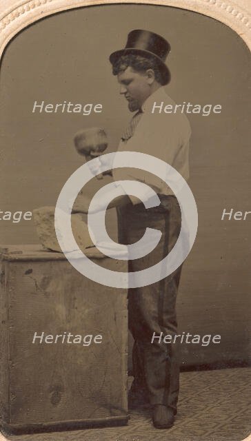 Mason in Top Hat with Mallet, Chisel, and Piece of Stone, 1870s-80s. Creator: J. R. Martin.