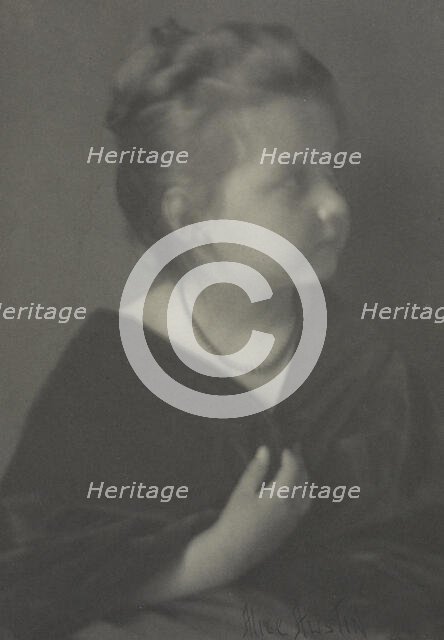 Portrait of a girl with a necklace clasping a shawl, c1900. Creator: Alice Austin.
