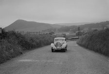 Jaguar SS saloon of N Howfield competing in the South Wales Auto Club Welsh Rally, 1937 Artist: Bill Brunell.