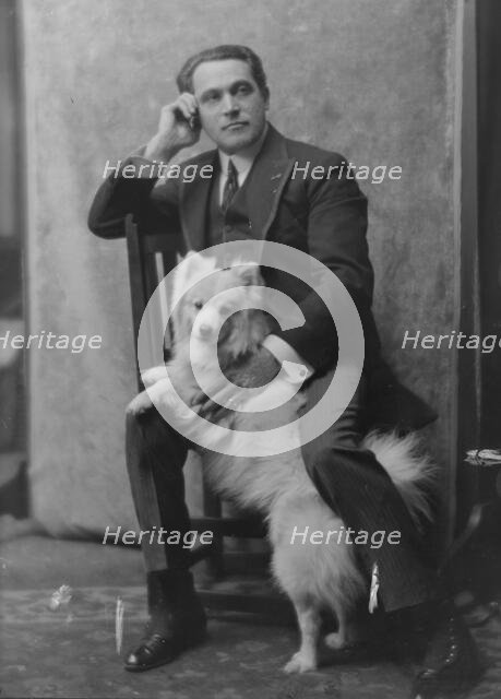 Spirescu, Steraskon, Mr., with dog, portrait photograph, 1917 Mar. 1. Creator: Arnold Genthe.