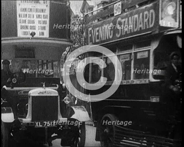 Buses Driving by in London, 1922. Creator: British Pathe Ltd.