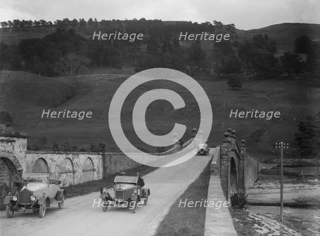 Lagonda of WH Oates, Calcott open tourer and Wolseley at the Scottish Light Car Trial, 1922. Artist: Bill Brunell.