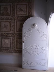 Studded door and mosaic, El Jem Museum, El Djem, Tunisia, 2009. Creator: Amanda Waite.