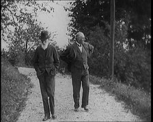 George Bernard Shaw Walking Down a Country Lane With a Male Civilian, 1920s. Creator: British Pathe Ltd.