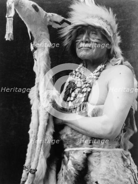 White deerskin dance costume-Hupa, c1923. Creator: Edward Sheriff Curtis.