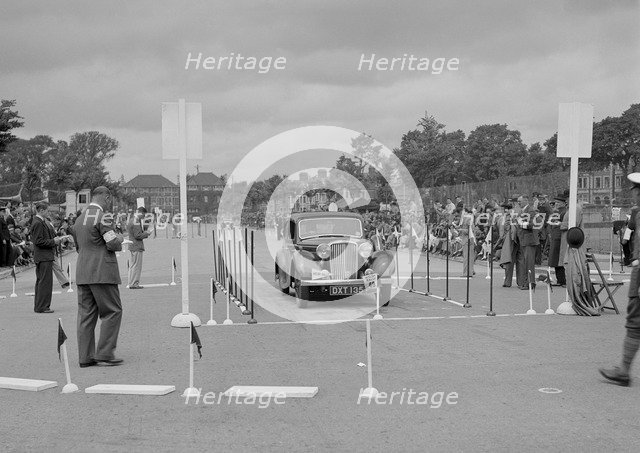 Jaguar SS saloon of HT Lewis competing in the South Wales Auto Club Welsh Rally, 1937 Artist: Bill Brunell.