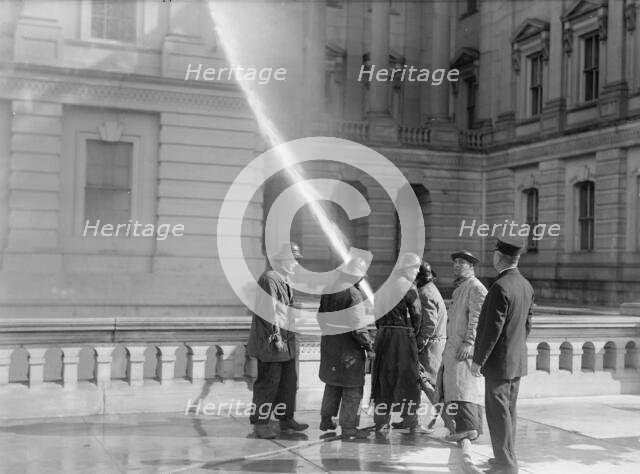 U.S. Capitol - Cleaning Exterior, 1913. Creator: Harris & Ewing.
