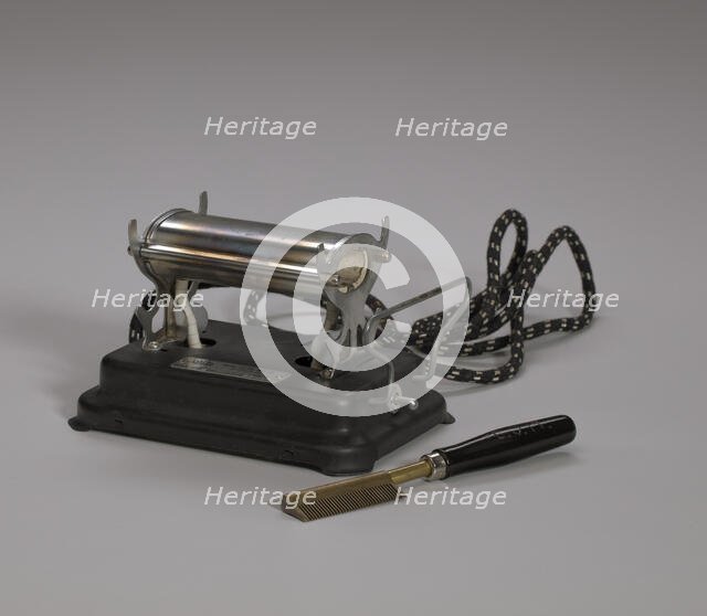 Electrical hot comb heater and hot comb, 1920s. Creator: Unknown.