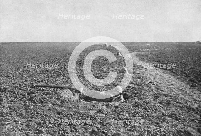 'Dans la Bataille; A la guerre de tranchee a succede, pour un temps, la guerre de trous..., 1918. Creator: Unknown.