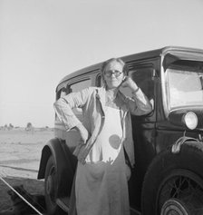 A grandmother from Oklahoma. She works in the California pea fields. Calipatria, California, 1939. Creator: Dorothea Lange.