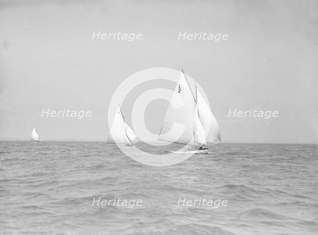The 6 Metre 'The Whim' (L6) and 'Correnzia' racing downwind, 1911. Creator: Kirk & Sons of Cowes.