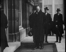 British Secretary of State for the Colonies Winston Churchill Exiting a Building, 1921. Creator: British Pathe Ltd.