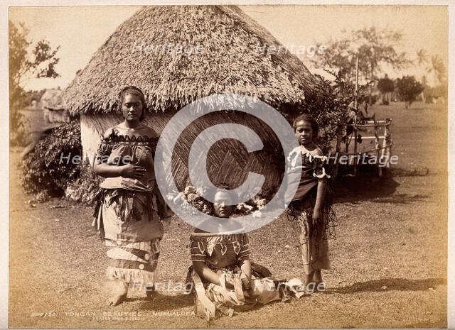Nuku'alofa, Tonga: three Tongan women in front of a traditional hut, c1870s. Creator: Burton Brothers.