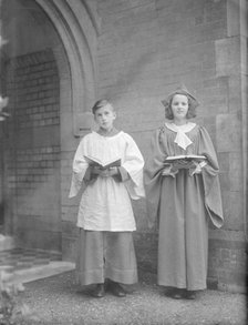 Girl and boy chorister, (Isle of Wight?), c1935. Creator: Kirk & Sons of Cowes.
