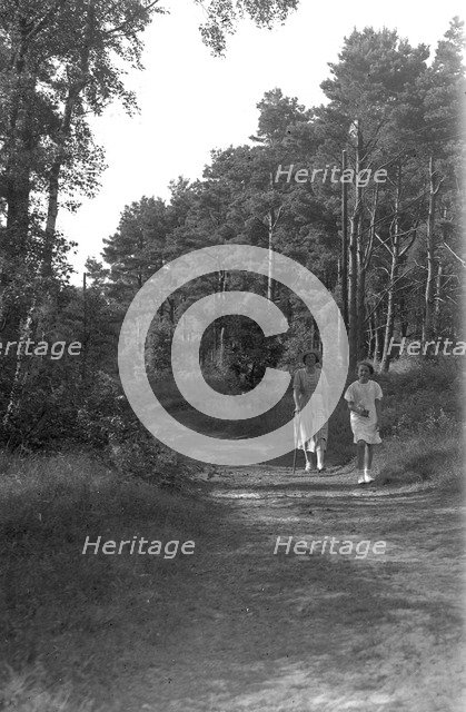 A mother and daughter walking in the forest, Skälderviken, Sweden, 1920s. Artist: Unknown