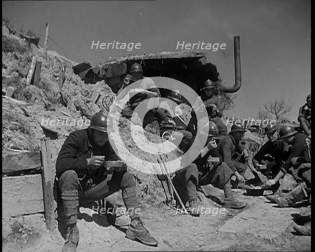 French Soldiers Eating a Meal in a Dug Out, 1940. Creator: British Pathe Ltd.