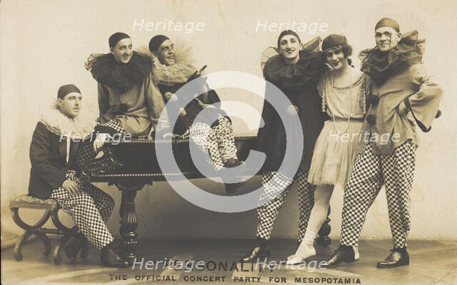 Soldiers, one in drag, performing in the concert party for Mesopotamia, posing...(1910-1919?). Creator: Hana Studios.