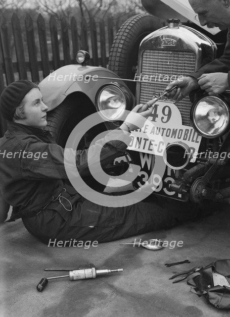 Kitty Brunell working on her Singer Junior, Monte Carlo Rally, 1928. Artist: Bill Brunell.