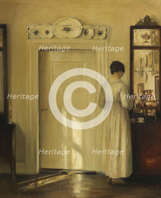 Interior with woman making tea, c1900-1910. Creator: Holsøe; Carl (1863-1935).